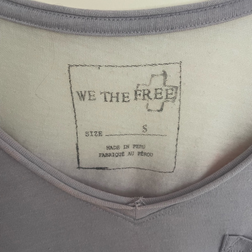 Free people, light purple t-shirt.